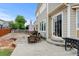 Relaxing backyard with patio, outdoor seating, and mature landscaping, ideal for entertaining at 282 Vialpando St, Brighton, CO 80601