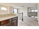 Upstairs landing with neutral carpet and dark bannister overlooks the entry at 282 Vialpando St, Brighton, CO 80601