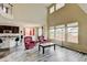Open concept living space features hardwood floors, ample natural light, and a view of the kitchen at 282 Vialpando St, Brighton, CO 80601