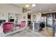 Spacious living room offers hardwood floors, a fireplace, and seamless flow into the adjacent kitchen at 282 Vialpando St, Brighton, CO 80601