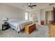 Spacious main bedroom with a ceiling fan and access to the ensuite bathroom with separate tub and shower at 282 Vialpando St, Brighton, CO 80601
