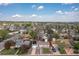 Aerial view of a neighborhood showcasing cozy homes, lush trees, and clear blue sky at 7286 Wolff St, Westminster, CO 80030