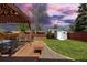 Spacious backyard with wooden fence, shed, and a patio at 7286 Wolff St, Westminster, CO 80030