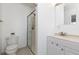 Bathroom features a single vanity, toilet, and glass enclosed shower with modern fixtures at 7286 Wolff St, Westminster, CO 80030