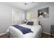 Bright bedroom with a comfortable bed, soft lighting, and ensuite bathroom at 7286 Wolff St, Westminster, CO 80030