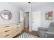 Comfortable bedroom with a modern dresser, wooden accents, and neutral decor at 7286 Wolff St, Westminster, CO 80030