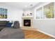This living room features a fireplace, large sectional sofa, and neutral tones at 7286 Wolff St, Westminster, CO 80030