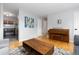 Bright living room with hardwood floors, light gray walls, artwork, and a wood coffee table at 7286 Wolff St, Westminster, CO 80030