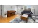 Cozy living room featuring a piano, a neutral-colored sofa, and natural light at 7286 Wolff St, Westminster, CO 80030