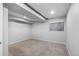 Neutral basement room with closet and window at 17698 E Loyola Dr # E, Aurora, CO 80013