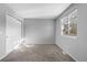 Simple bedroom featuring neutral colors, a large closet and a sunlit window at 17698 E Loyola Dr # E, Aurora, CO 80013