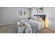 Cozy bedroom with natural light, neutral tones, and modern accent pieces at 17698 E Loyola Dr # E, Aurora, CO 80013