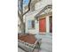 Charming townhouse featuring a vibrant red front door and well-maintained landscaping at 17698 E Loyola Dr # E, Aurora, CO 80013