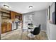 Charming kitchen area featuring stainless appliances, tile backsplash and adjacent dining area with walk-out patio doors at 17698 E Loyola Dr # E, Aurora, CO 80013