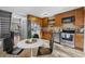 Charming kitchen featuring stainless steel appliances and ample cabinet space at 17698 E Loyola Dr # E, Aurora, CO 80013