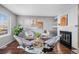 Inviting living room featuring a cozy fireplace and modern decor at 17698 E Loyola Dr # E, Aurora, CO 80013
