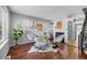 Cozy living room featuring hardwood floors, fireplace, and modern decor at 17698 E Loyola Dr # E, Aurora, CO 80013