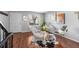 Bright living room showcasing hardwood floors and a cozy seating area at 17698 E Loyola Dr # E, Aurora, CO 80013