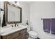 This bathroom features a vanity with white countertops, and a framed mirror and towel rack at 10530 Mount Columbia Pl, Parker, CO 80138