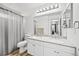 Bright bathroom with double sinks, elegant finishes, and tile flooring at 10530 Mount Columbia Pl, Parker, CO 80138