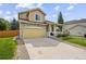 Attractive home with a stone facade, covered porch and a two-car garage with driveway at 10530 Mount Columbia Pl, Parker, CO 80138