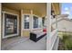 Inviting front porch showcasing a cozy seating area, perfect for relaxing outdoors at 10530 Mount Columbia Pl, Parker, CO 80138