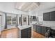 Modern kitchen featuring stainless steel appliances, marble countertops, and an island at 10530 Mount Columbia Pl, Parker, CO 80138