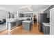 Modern kitchen featuring gray cabinets, stainless steel appliances, and a center island at 10530 Mount Columbia Pl, Parker, CO 80138