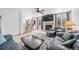 Spacious living room with a fireplace, mounted TV, and two sofas, perfect for relaxation at 10530 Mount Columbia Pl, Parker, CO 80138