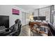 This office features modern laminate floors, neutral walls, and a large window for ample natural light at 10530 Mount Columbia Pl, Parker, CO 80138