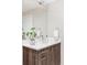 Bathroom featuring modern vanity with quartz countertop, wood cabinetry and silver hardware, and a neutral paint palette at 4485 Tennyson St # 5, Denver, CO 80212