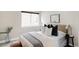 Stylishly decorated bedroom featuring a plush bed with decorative pillows and a cozy atmosphere at 4485 Tennyson St # 5, Denver, CO 80212