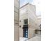 Modern townhome features sleek lines, neutral siding, and a blue front door, complemented by street parking at 4485 Tennyson St # 5, Denver, CO 80212