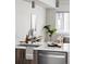 Close up of modern sink with light countertop, stainless steel dishwasher, and sleek faucet at 4485 Tennyson St # 5, Denver, CO 80212