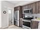 Modern kitchen featuring stainless steel appliances next to a water closet at 4485 Tennyson St # 5, Denver, CO 80212