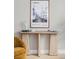 Elegant living room showcasing natural wood console table and a framed California print at 4485 Tennyson St # 5, Denver, CO 80212