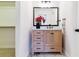 Bathroom with a wooden vanity, marble countertop, and sleek black hardware at 215 Locust Ln, Denver, CO 80220