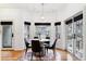 Bright dining area with modern light fixture, hardwood flooring and natural light at 215 Locust Ln, Denver, CO 80220