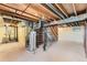 Unfinished basement with visible utilities and concrete flooring, ready for customization at 5260 Garrison St # 11, Arvada, CO 80002