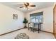 This bedroom features neutral decor, desk with chair and a window at 5260 Garrison St # 11, Arvada, CO 80002