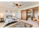 This bedroom features neutral decor, ceiling fan, and two closets at 5260 Garrison St # 11, Arvada, CO 80002