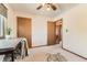Bedroom with neutral carpet, ceiling fan, and natural light from window at 5260 Garrison St # 11, Arvada, CO 80002