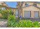 Brick townhouse with garage, walkway, and garden at 5260 Garrison St # 11, Arvada, CO 80002