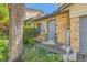 Charming brick townhouse with a well-manicured front yard and welcome sign at 5260 Garrison St # 11, Arvada, CO 80002