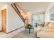 Bright and inviting living room with a staircase at 5260 Garrison St # 11, Arvada, CO 80002