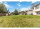 Spacious grassy backyard features a shed, patio area and mature trees at 10550 Routt St, Westminster, CO 80021