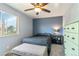 Cozy bedroom featuring a full-size bed and an abundance of natural light at 10550 Routt St, Westminster, CO 80021