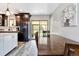 Elegant dining area with modern kitchen featuring stainless steel appliances and ample cabinet space at 10550 Routt St, Westminster, CO 80021