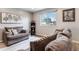 Comfortable living room featuring plush sofas, a soft rug, and lots of natural light at 10550 Routt St, Westminster, CO 80021