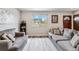 Comfortable living room featuring plush sofas, a soft rug, and lots of natural light at 10550 Routt St, Westminster, CO 80021